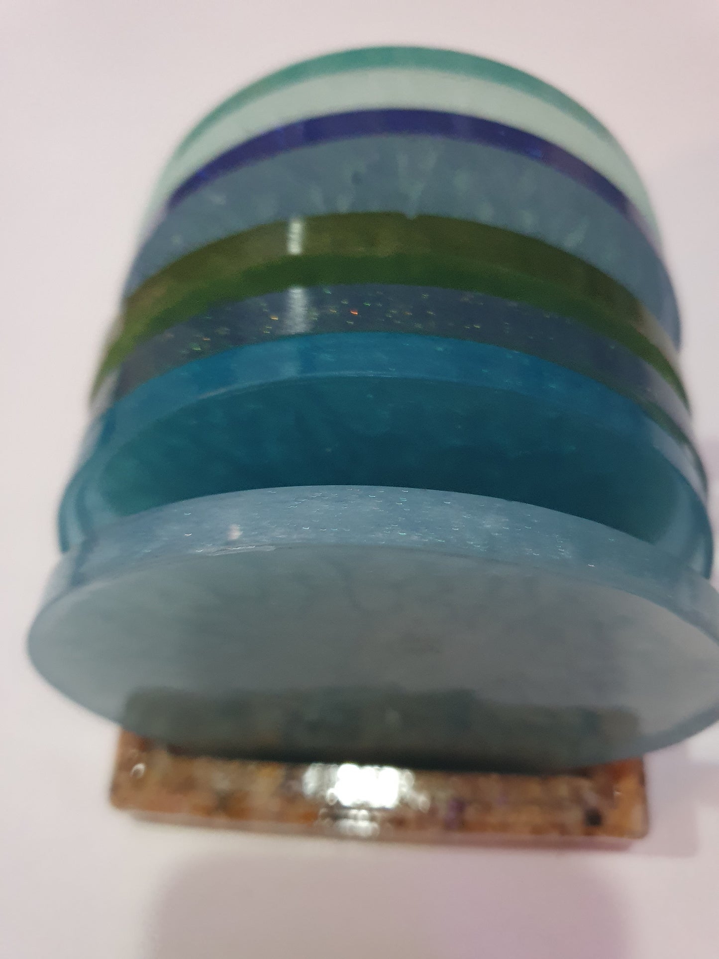 Functional art - round drink coasters and stand in the colours of the ocean