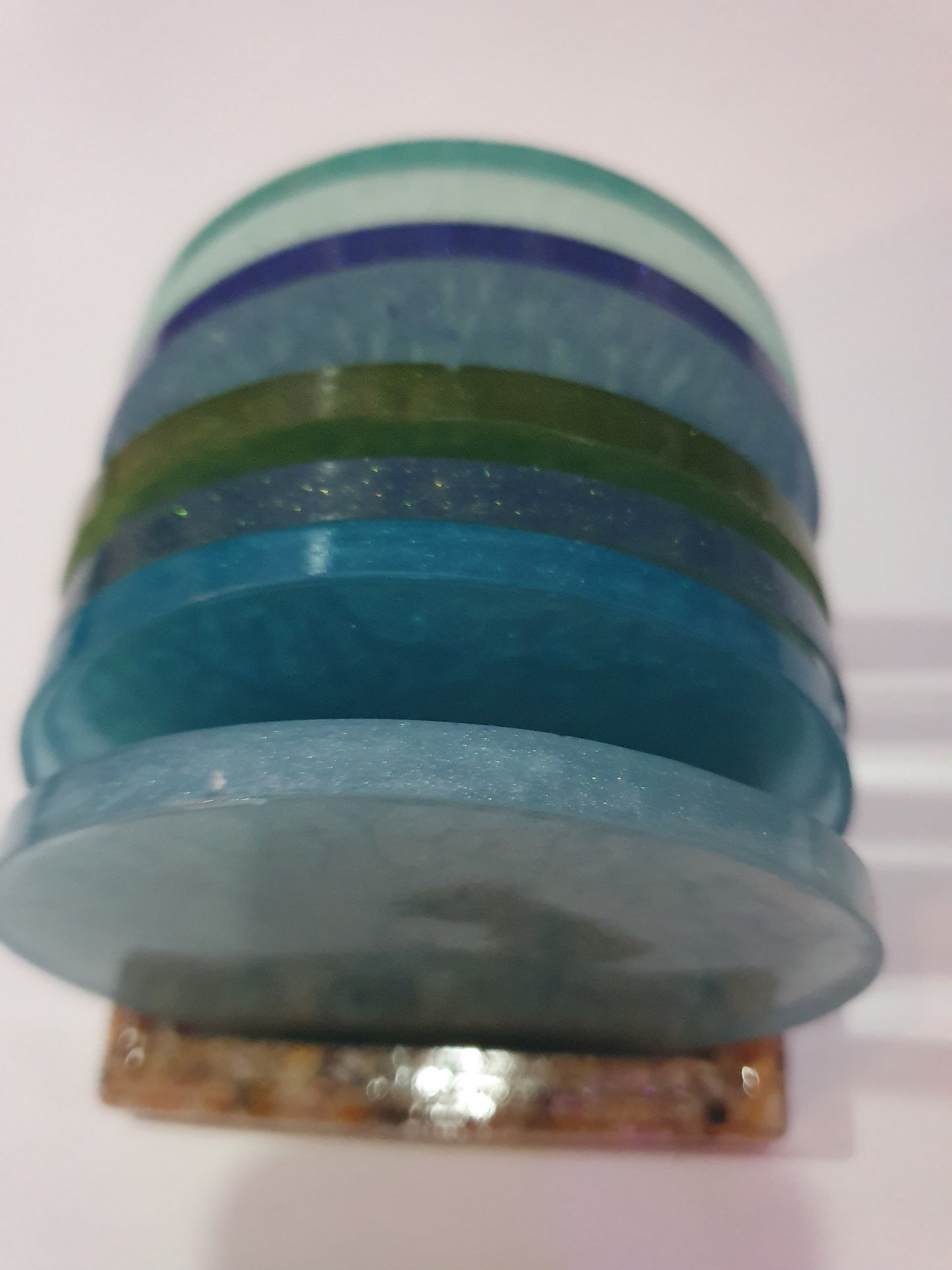 Functional art - round drink coasters and stand in the colours of the ocean