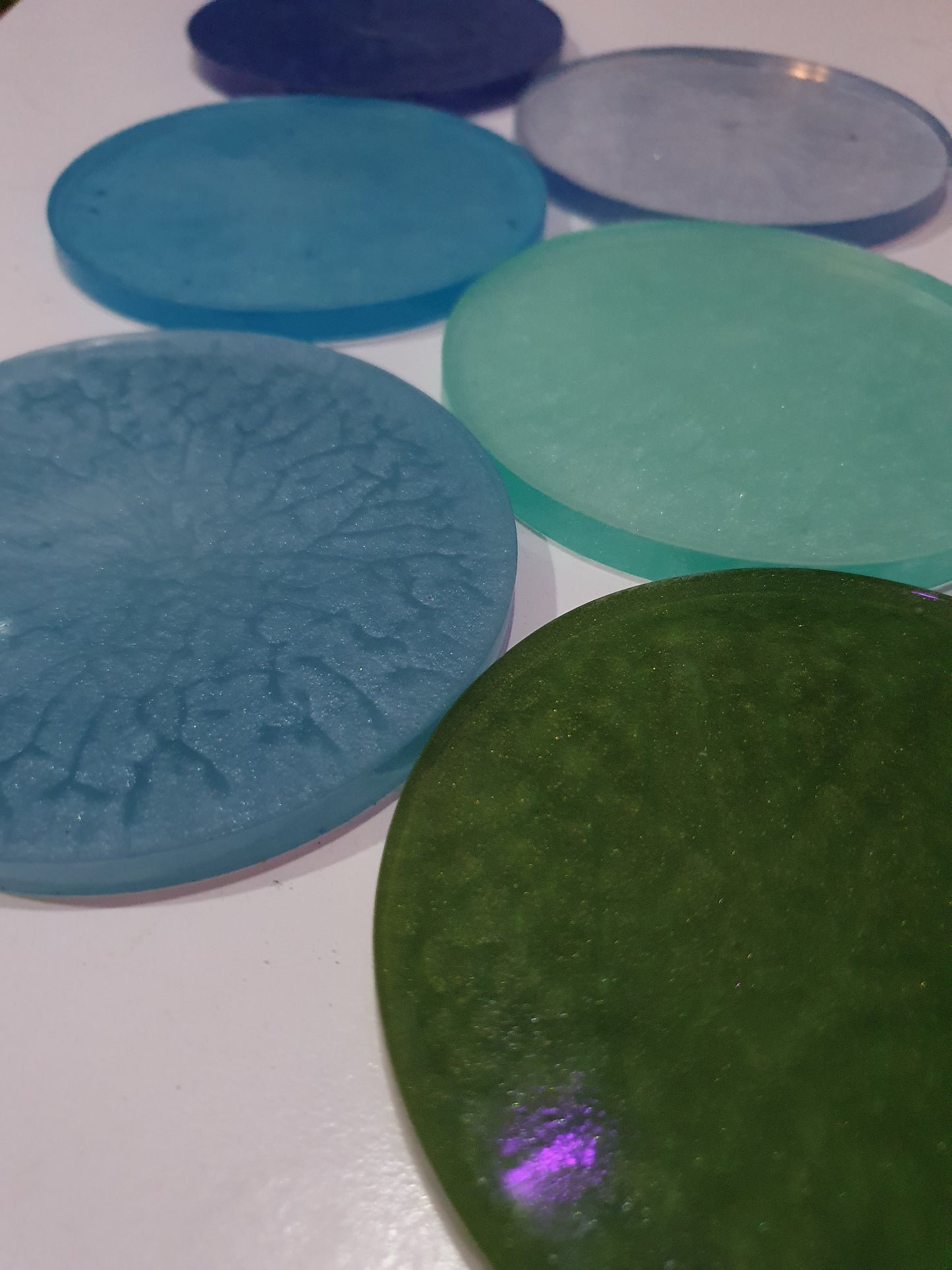 Functional art - round drink coasters and stand in the colours of the ocean