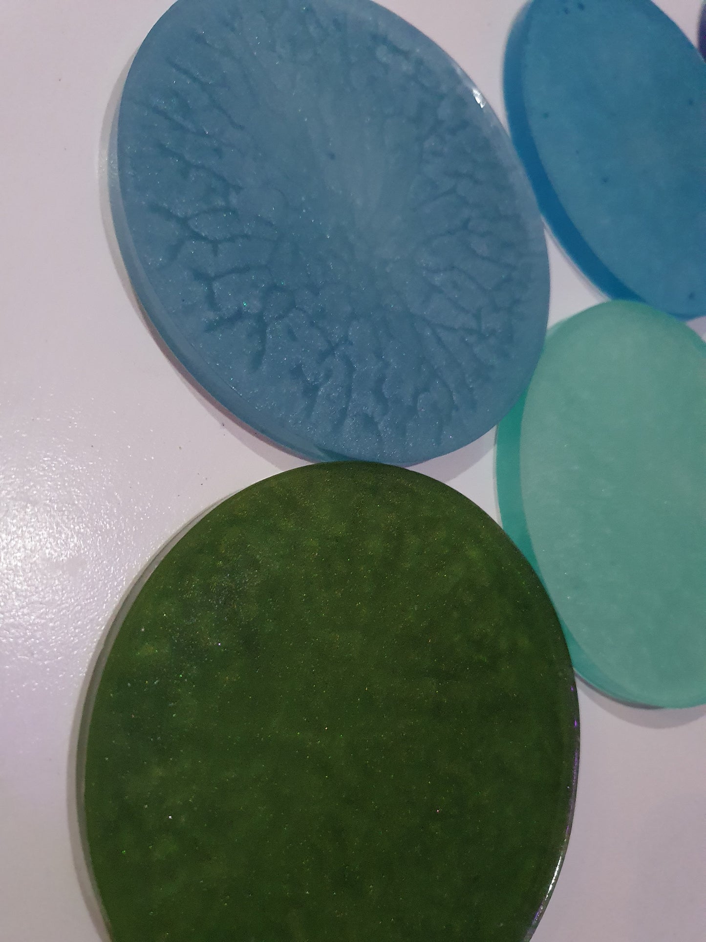 Functional art - round drink coasters and stand in the colours of the ocean