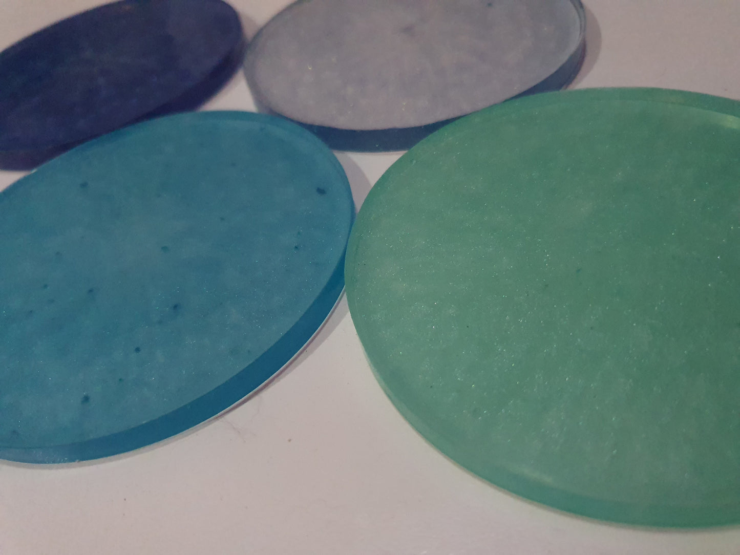 Functional art - round drink coasters and stand in the colours of the ocean