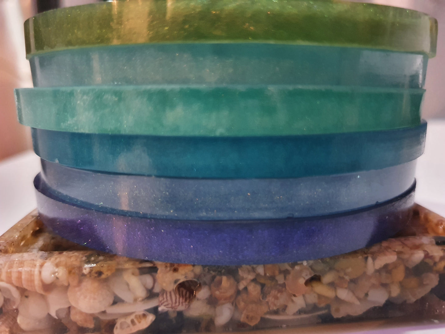 Functional art - round drink coasters and stand in the colours of the ocean