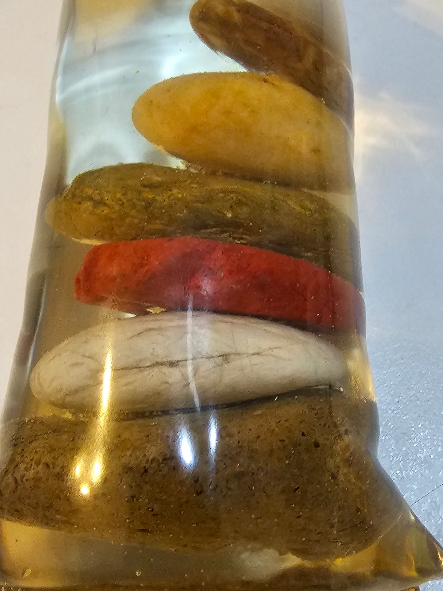 Stacked beach stones in a bottle or bag